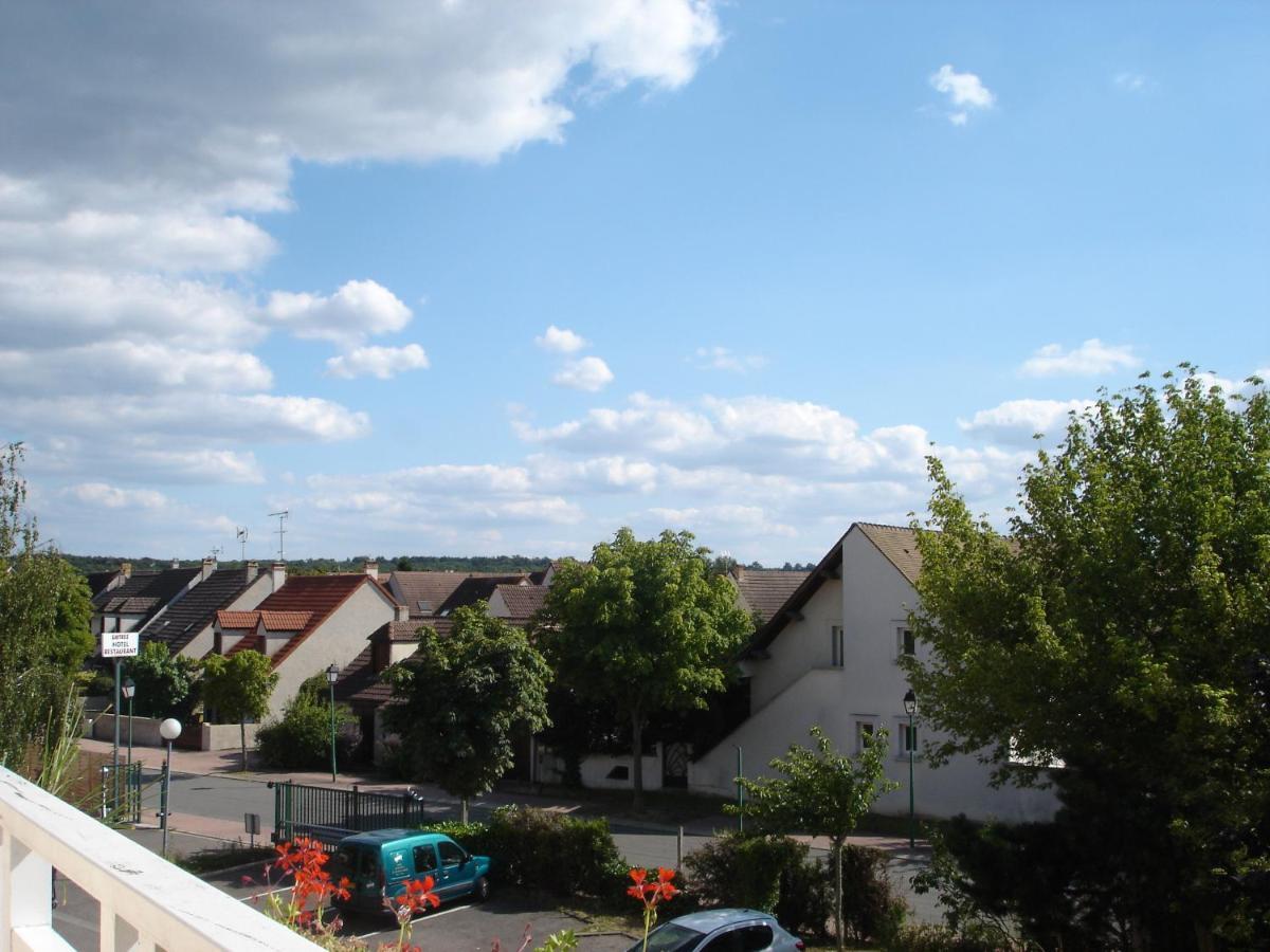 Kyriad Direct Acheres Exterior foto